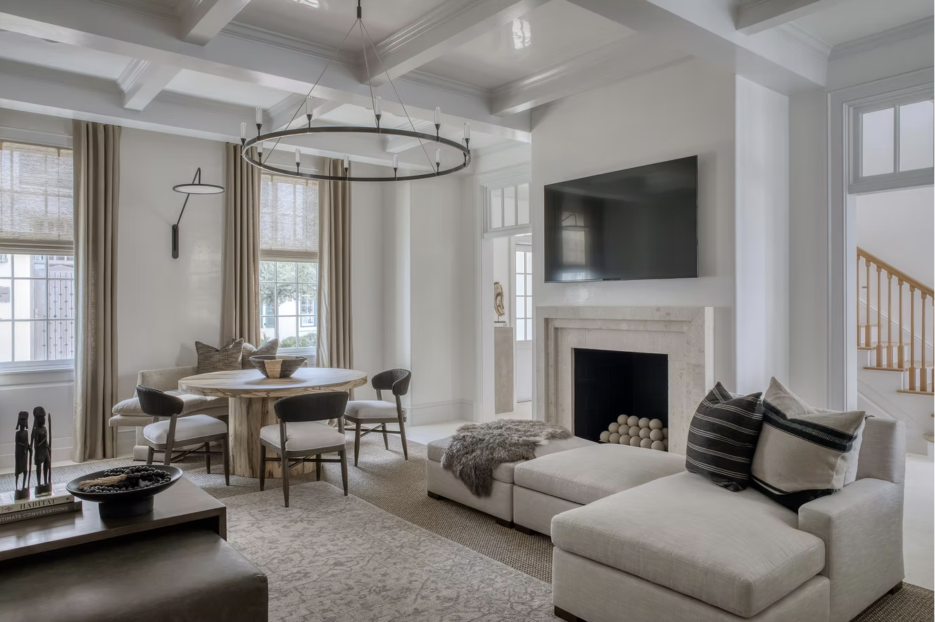 One peek at this stunning coastal home on Alys Beach designed by Brad Ramsey Interiors  and, you'll feel like you're a million miles away! Jack Gardner PHotography - neutral living room with wood beams