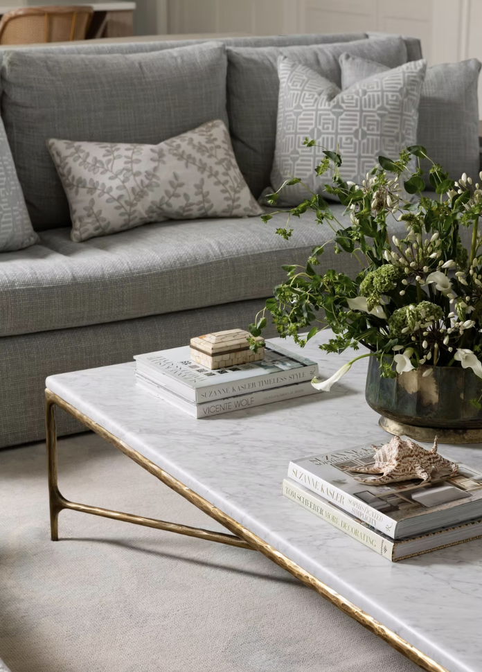 Now, we're back with another stylish home from this talented team that is one for the books, one that speaks to the very heart of the chic gorgeousness and soothing yet utterly chic simplicity that we're always hoping to achieve. The marble and brass coffee table is a favorite Photographed by Heather Ison  Styled by Ashley Hotham Cox