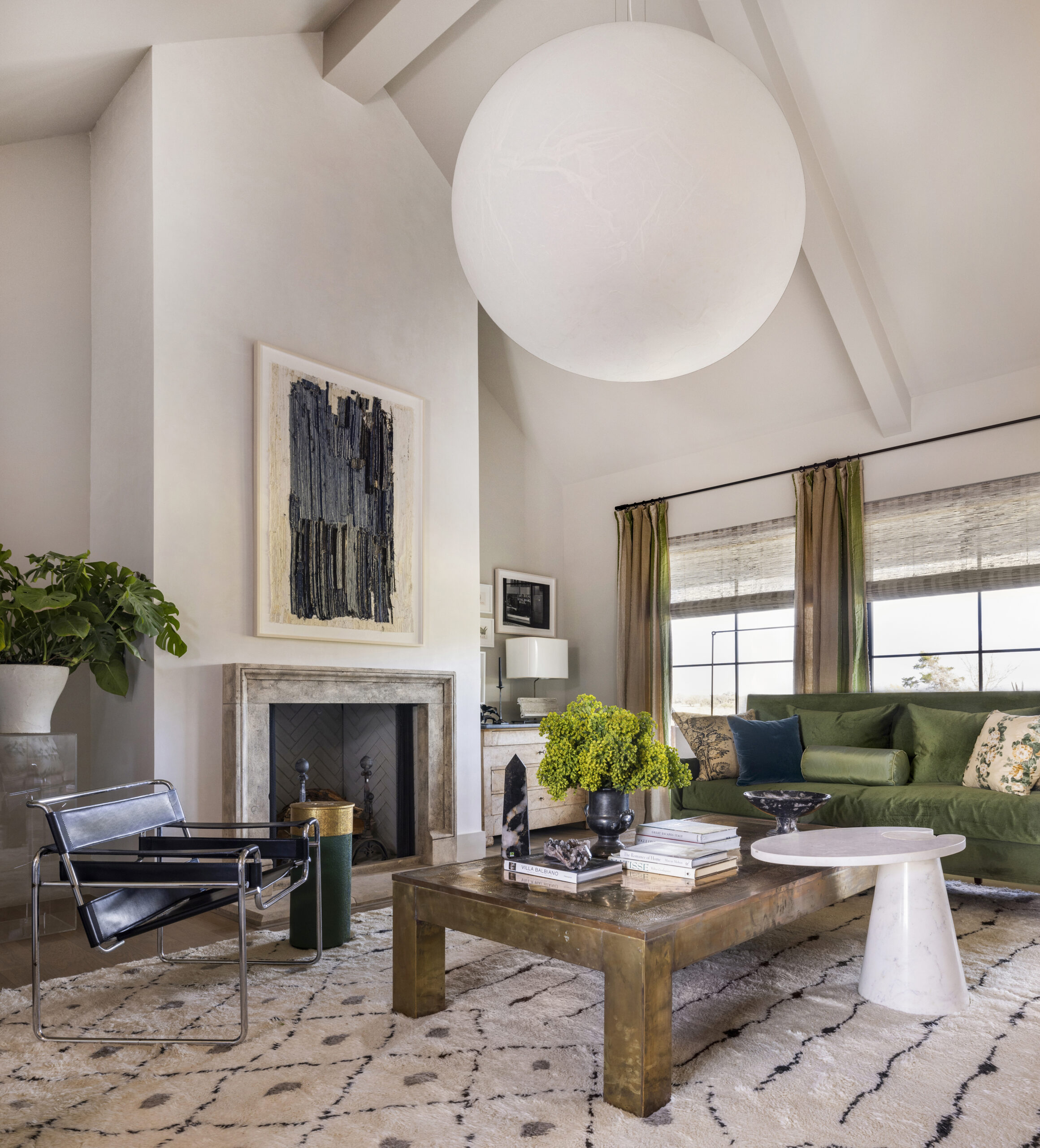 Cozy living room interiors with large round chandelier, featuring unified color palette. We are so excited to share the stunning Round Top Designer Showhouse rooms by the talented Mohon Interiors. Julie Soefer Photography