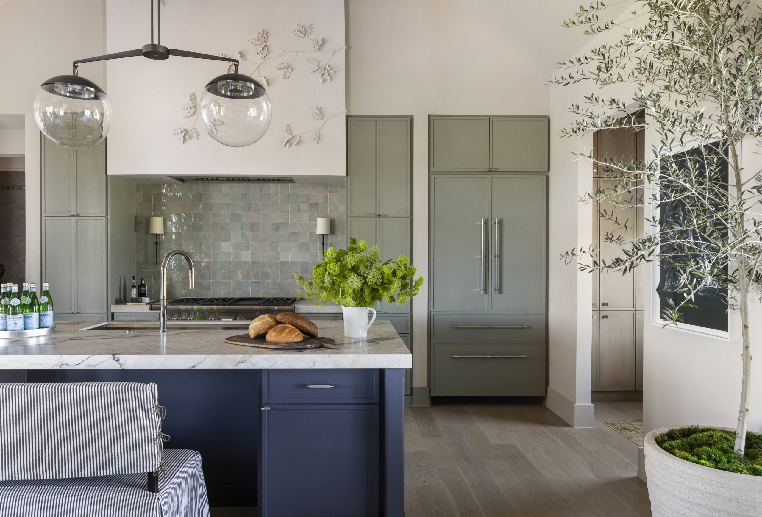 Modern kitchen design from Round Top Designer Showhouse with sleek countertops and warm lighting -photography by Julie Soefer 