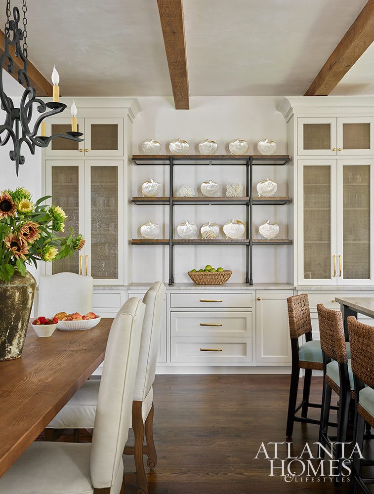 Who couldn’t help but fall in love at first sight with this Sea Island retreat? In calming colors and soothing tones, this home is nothing short of a sanctuary–with views for day. Atlanta Homes & Lifestyles Interior Designer: Courtney Giles Interiors,  Architect: Josh G. Youngner Architect, Builder: The Van Waters Company, Original Architect: Thomas Thaddeus Truett Architect, 