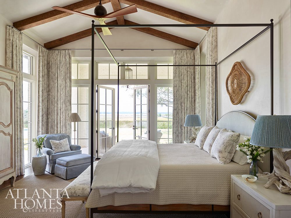 Who couldn’t help but fall in love at first sight with this Sea Island retreat? In calming colors and soothing tones, this home is nothing short of a sanctuary–with views for day. Atlanta Homes & Lifestyles Interior Designer: Courtney Giles Interiors,  Architect: Josh G. Youngner Architect, Builder: The Van Waters Company, Original Architect: Thomas Thaddeus Truett Architect, 