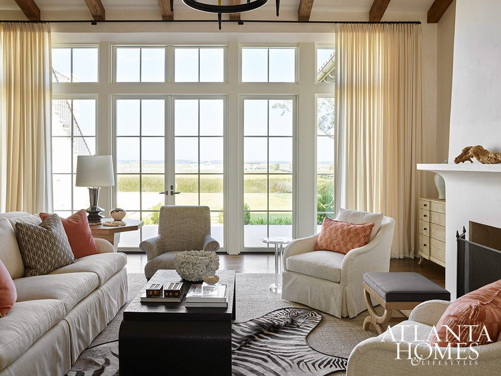 Who couldn’t help but fall in love at first sight with this stunning Sea Island home? In calming colors and soothing tones, this home is nothing short of a sanctuary–with views for day. Atlanta Homes & Lifestyles Interior Designer: Courtney Giles Interiors,  Architect: Josh G. Youngner Architect, Builder: The Van Waters Company, Original Architect: Thomas Thaddeus Truett Architect, 